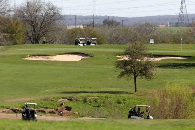 Stray bullet hits golfer